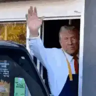 Donald Trump waving from a window