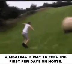 man running into hay bale