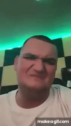 Man squinting in green light