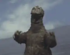 Godzilla shrugging