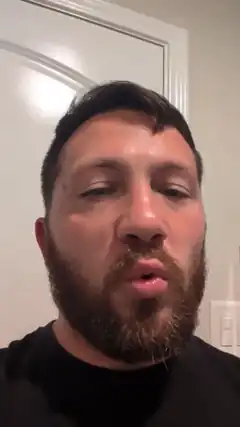 bearded man making kissing face