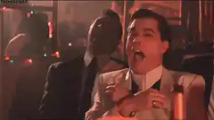 Two men laughing hysterically in a club