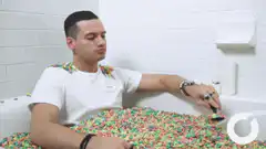 Man eating cereal in bathtub