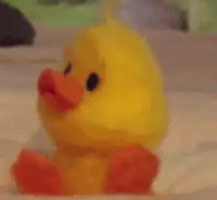 yellow rubber duck with big eyes