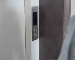 Person pressing elevator button