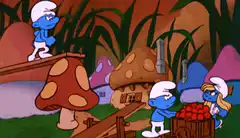 Smurf on a seesaw with other Smurfs