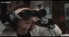 Woman looking through binoculars