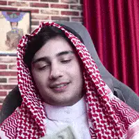 Man in keffiyeh counting money