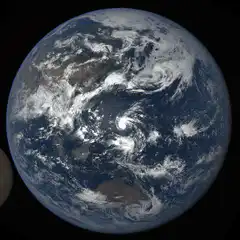 Earth and Moon rotating in space