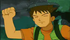 Brock holding an umbrella in the rain