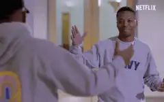 Chance the Rapper hugs a friend