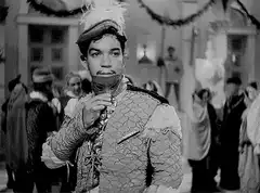 Man holding a mask at a masquerade