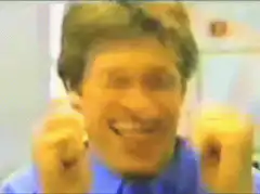 Man laughing with fists pumping