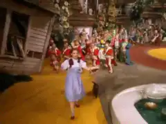 Dorothy and Toto running on the yellow brick road