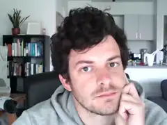 man resting chin on hand