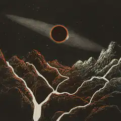 Solar eclipse over mountain range