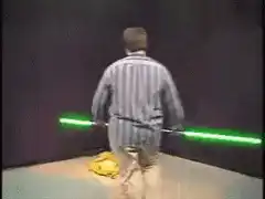 man lights lightsaber on fire