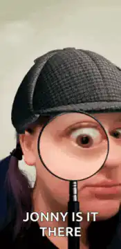 Woman looking through magnifying glass