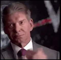 Vince McMahon nodding and pointing