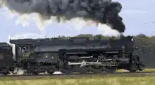 steam train moving with smoke