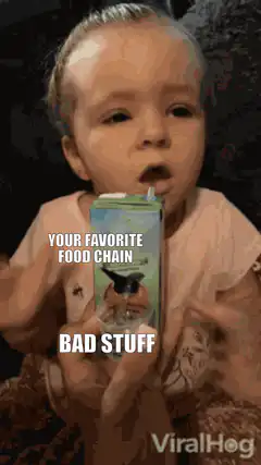 Baby drinking juice box with text