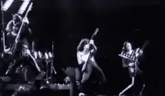 Glam rock band performing on stage