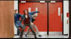 High school students dancing in hallway