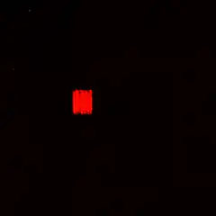 red pixel art shapes on black