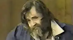 Charles Manson smirking