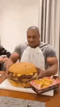 Man lifts giant burger