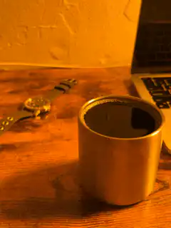 Coffee cup on wooden desk