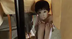 Woman peeking under table