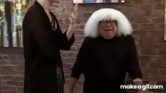 Woman in white wig reacts to painting