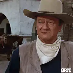 John Wayne nodding and pointing