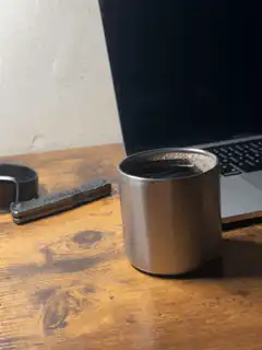 steam rising from metal cup