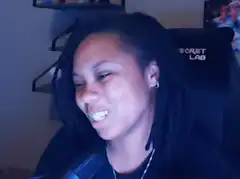 Woman laughing hysterically in gaming chair