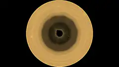 Top-down view of a coffee cup with dark liquid