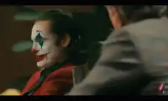 Joker laughing in a car