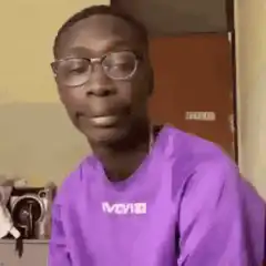 Man takes off glasses and looks down