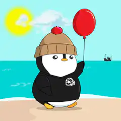 Penguin with red balloon on beach