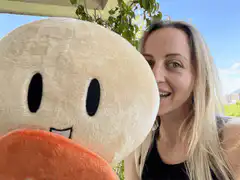 woman with bitcoin plush toy