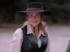 Young girl in cowboy hat smiling