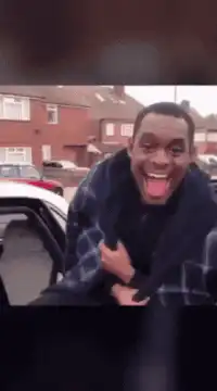 Man excitedly getting into a car