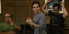 Three men dancing in a room