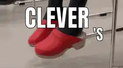 Red clogs balancing on chair rung