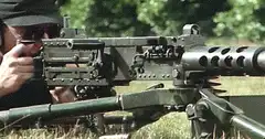 Soldier firing a heavy machine gun