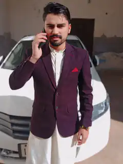 man in purple blazer talking on phone