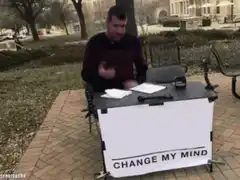 man sitting at change my mind table