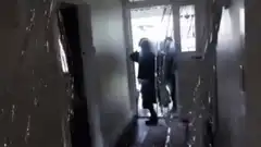 SWAT team throws a rubber chicken