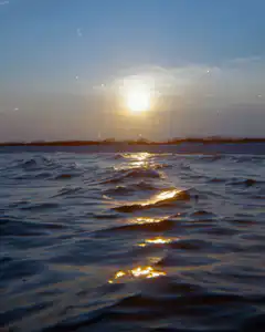 Sunset over rippling water
